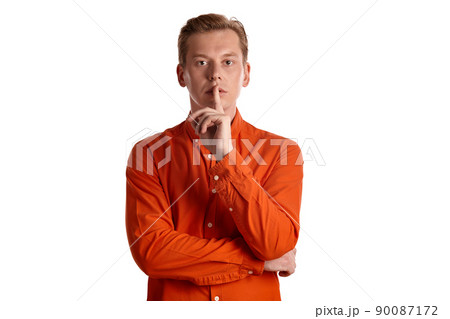 Close-up portrait of a ginger guy in orange shirt posing isolated on white background. Sincere emotions. Close-up portrait of a ginger guy in orange shirt posing isolated on white background. Sincere emotions. 90087172