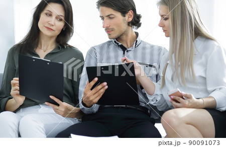 business team reading work documents. office life 90091073