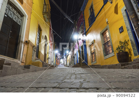 Night streets with car lights trails in City of Guanajuato, Mexico Night streets with car lights trails in City of Guanajuato, Mexico 90094522