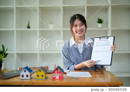 Portrait real estate agent adviser show contract agreement on workplace Portrait real estate agent adviser show contract agreement on workplace 90096599