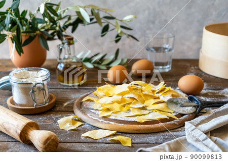 Homemade pasta Maltagliati with ingredients in rustic style Homemade pasta Maltagliati with ingredients in rustic style 90099813