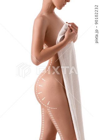 Female body with the drawing arrows on it isolated on white. Fat lose, liposuction and cellulite removal concept. 90102232