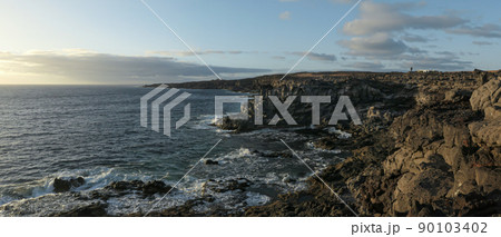 Panoramic view of volcanic landscape on the coast of Lanzarote, Canary Islands, Spain. Panoramic view of volcanic landscape on the coast of Lanzarote, Canary Islands, Spain. 90103402