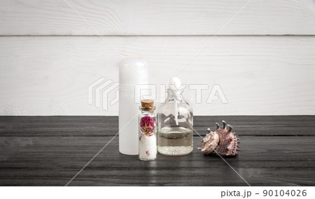 Spa beauty cosmetic products on white and black wooden background. Copyspace 90104026