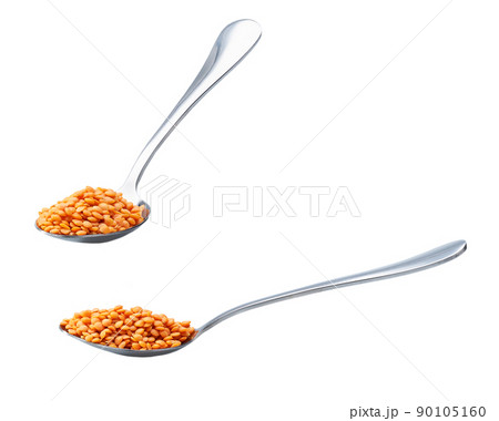 metal spoon with red lentils isolated on white background. metal spoon with red lentils isolated on white background. 90105160