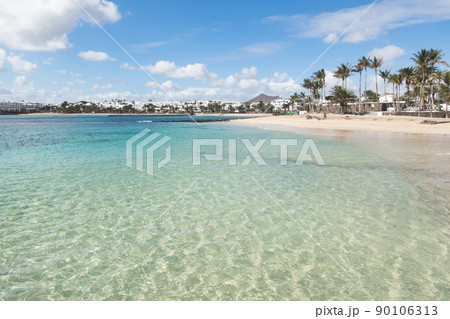 Sunny beach in, costa Teguise, Lanzarote, Canary Islands, Spain. Sunny beach in, costa Teguise, Lanzarote, Canary Islands, Spain. 90106313