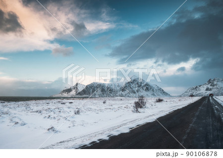 Skagsanden beach with snow covered mountain range on coastline in winter at Lofoten Islands Skagsanden beach with snow covered mountain range on coastline in winter at Lofoten Islands 90106878