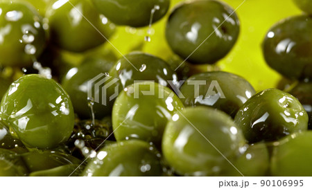 Close-up of green olives placed in oil. Close-up of green olives placed in oil. 90106995
