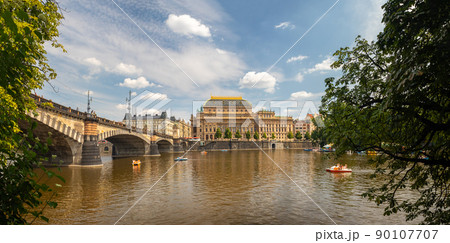 National Theatre building and Legion Bridge, Prague, Czech republic, waterfront view across the river Vltava 90107707