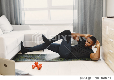 Man in a isolations. Guy training online. Man using a laptop. Man in a isolations. Guy training online. Man using a laptop. 90108074