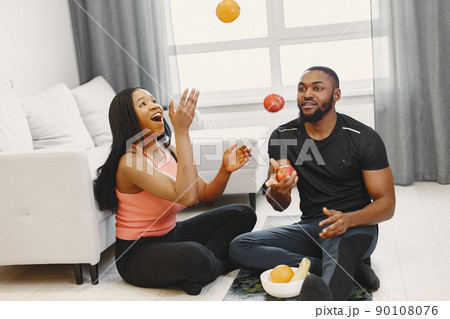 People in a isolations. Couple prepare for training in a room. People in a isolations. Couple prepare for training in a room. 90108076