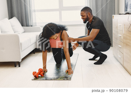 People in a isolations. Couple training in a room. People in a isolations. Couple training in a room. 90108079