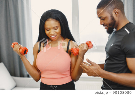 People in a isolations. Couple training in a room. People in a isolations. Couple training in a room. 90108080