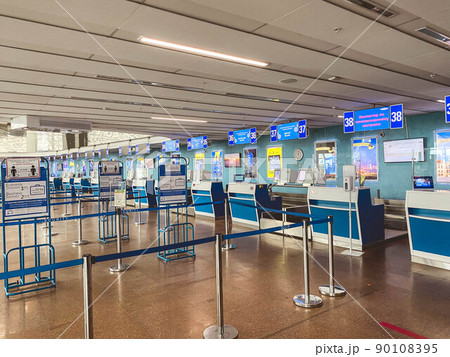 separation of passenger flows at the airport. covid measures, safe distance of people. antiviral measures, empty queues without people, no boarding separation of passenger flows at the airport. covid measures, safe distance of people. antiviral measures, empty queues without people, no boarding 90108395