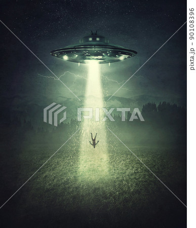 Mysterious alien spaceship abduction scene. Surreal concept with a levitating human stolen by the light of an UFO ship in a dark night on a open field Mysterious alien spaceship abduction scene. Surreal concept with a levitating human stolen by the light of an UFO ship in a dark night on a open field 90108396