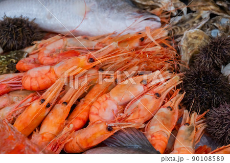 Raw red prawns on counter at food market - close up 90108589