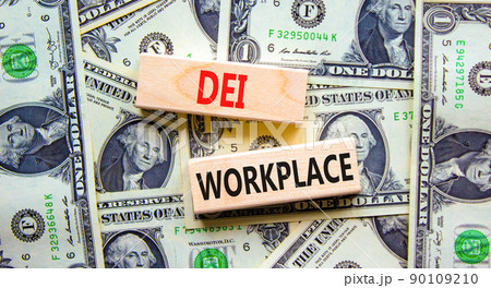 DEI diversity equity inclusion workplace symbol. Blocks with words DEI workplace on beautiful background from dollar bills. Business DEI diversity equity inclusion workplace concept. Copy space. DEI diversity equity inclusion workplace symbol. Blocks with words DEI workplace on beautiful background from dollar bills. Business DEI diversity equity inclusion workplace concept. Copy space. 90109210