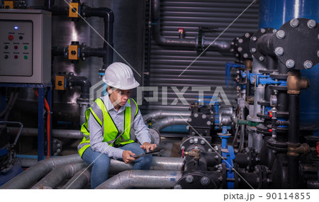 Industry engineer under checking the industry cooling tower air conditioner is water cooling tower air chiller HVAC of large industrial building to control air system Industry engineer under checking the industry cooling tower air conditioner is water cooling tower air chiller HVAC of large industrial building to control air system 90114855