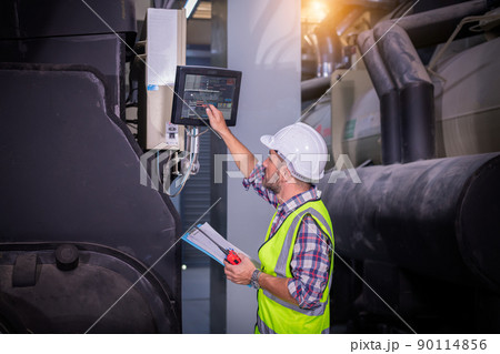Industry engineer under checking the industry cooling tower air conditioner is water cooling tower air chiller HVAC of large industrial building to control air system Industry engineer under checking the industry cooling tower air conditioner is water cooling tower air chiller HVAC of large industrial building to control air system 90114856