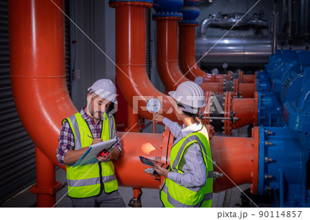 Industry engineer under checking the industry cooling tower air conditioner is water cooling tower air chiller HVAC of large industrial building to control air system 90114857