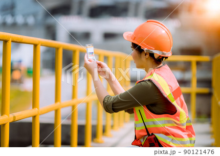 Worker under checking the  waste water treatment pond industry large to control water support industry  90121476
