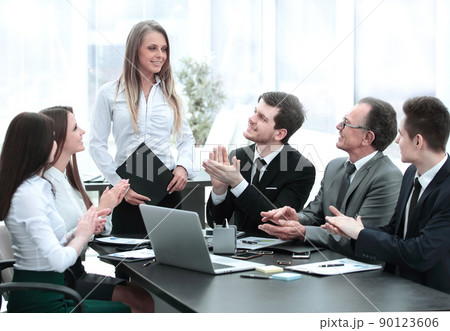 business team applauding the speaker at the meeting. business team applauding the speaker at the meeting. 90123606