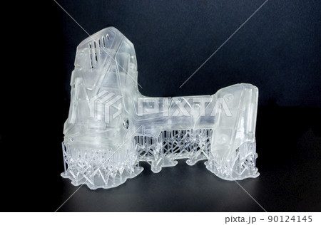 Abstract model printed on 3d printer close-up. Object photopolymer printed on stereolithography 3D printer. Technology of liquid photopolymerization under UV light. New additive 3D printing technology Abstract model printed on 3d printer close-up. Object photopolymer printed on stereolithography 3D printer. Technology of liquid photopolymerization under UV light. New additive 3D printing technology 90124145