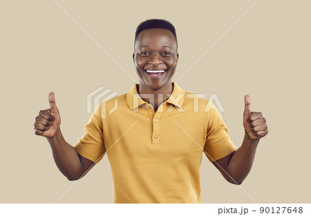 Smiling African American man show thumbs up 90127648