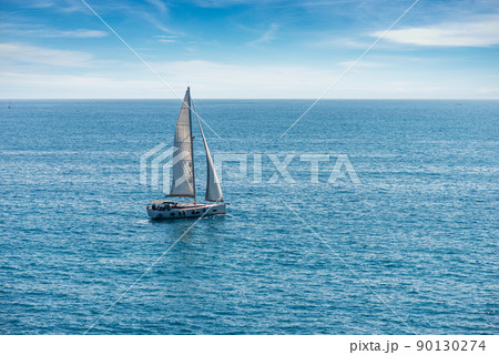 White Sailing Boat in the Blue Sea - Cinque Terre Liguria Italy White Sailing Boat in the Blue Sea - Cinque Terre Liguria Italy 90130274