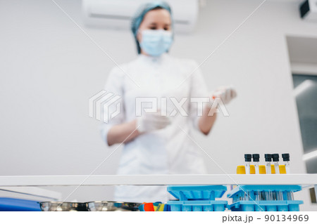 The patient takes a blood test at the clinic. The patient takes a blood test at the clinic. 90134969