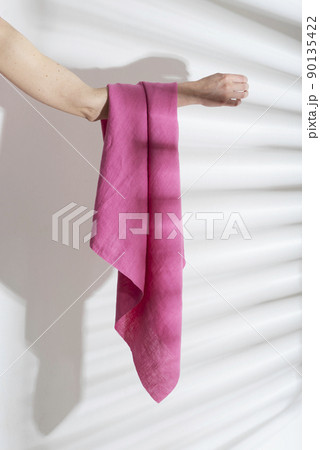 pink linen fabric on the woman hand pink linen fabric on the woman hand 90135422