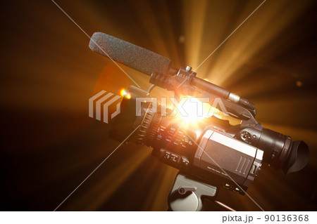 broadcast video camera against the shiny background 90136368