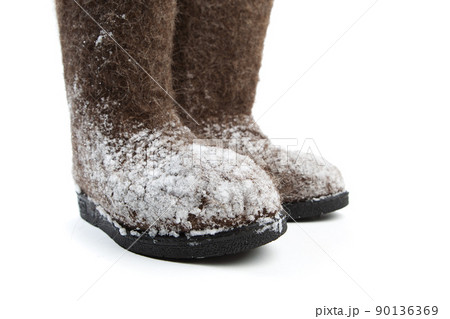 felt boots with snow isolated on white felt boots with snow isolated on white 90136369