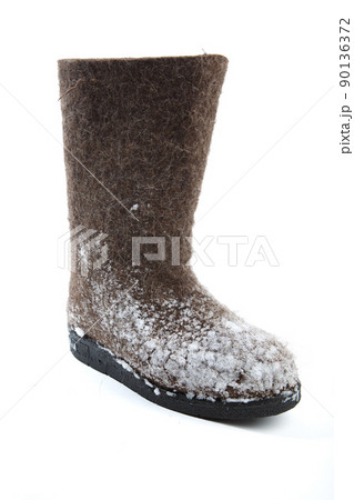 felt boots with snow isolated on white felt boots with snow isolated on white 90136372