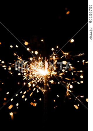 yellow sparkler with fire particles yellow sparkler with fire particles 90136739