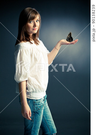 beautiful girl holding a butterfly beautiful girl holding a butterfly 90138239