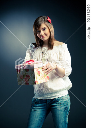 beautiful girl holding a gift beautiful girl holding a gift 90138240