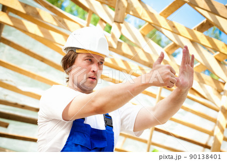 builder looking at the construction project builder looking at the construction project 90138401