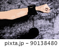 Hand with scars and handcuffs, abstrackt illustration 90138480