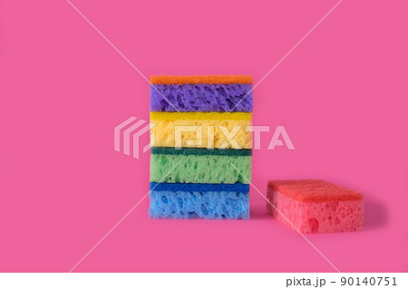 Sponges for washing dishes on a bright pink background Sponges for washing dishes on a bright pink background 90140751