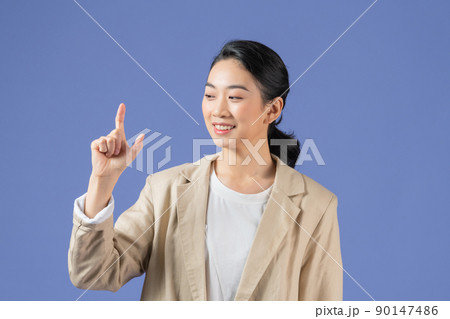 Asian girl holding something invisible in his hands, isolated 90147486