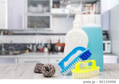 Bottles of dishwashing liquid, brushes and sponges. Bottles of dishwashing liquid, brushes and sponges. 90150906