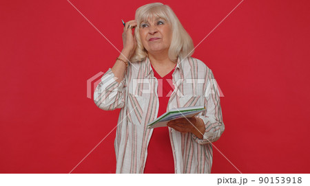 Thoughtful journalist woman making notes, writing down thoughts with pen into notepad notebook diary Thoughtful journalist woman making notes, writing down thoughts with pen into notepad notebook diary 90153918
