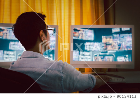 Businessman and eyeglasses working with charts and market reports on computer screens. Businessman and eyeglasses working with charts and market reports on computer screens. 90154113
