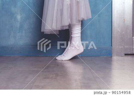 Woman dancer in white socks on floor. 90154958
