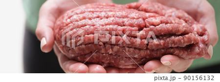 Female hands hold fresh minced meat, close-up Female hands hold fresh minced meat, close-up 90156132