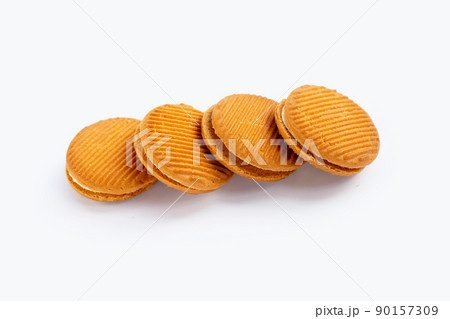 Custard cream sandwich biscuits on white background. 90157309