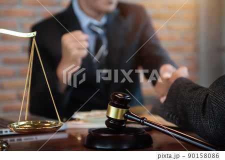 Business people and lawyers discussing contract papers sitting in the table at office in the morning. concepts of law, advice, legal services. 90158086