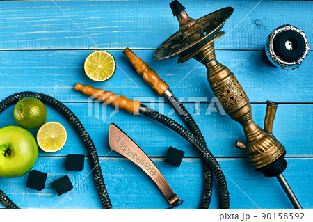 Hookah. Tobacco with apple and lime flavor. Top view Hookah. Tobacco with apple and lime flavor. Top view 90158592