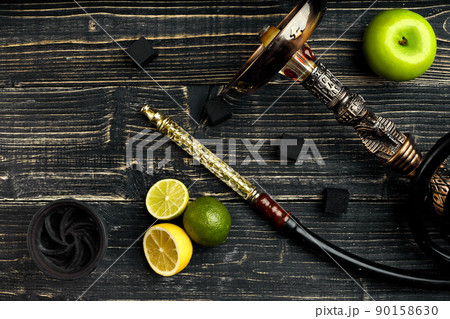 Arabic hookah with a tobacco flavor of a mixture of citruses and apple 90158630